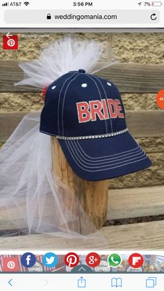 a baseball cap with the word bride on it sitting on top of a wooden post