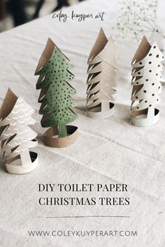 diy toilet paper christmas trees on a table