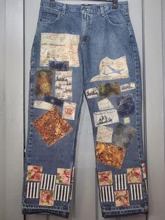 a pair of blue jeans with patches on them