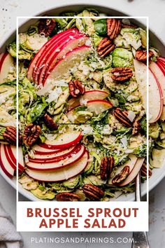 brussels sprout apple salad in a bowl with pecans