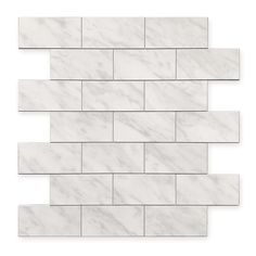 a white marble tile wall that looks like it's made out of brick tiles