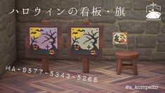 two wooden chairs sitting next to each other in front of a brick wall with paintings on it