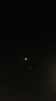 the moon and venus are visible in the night sky