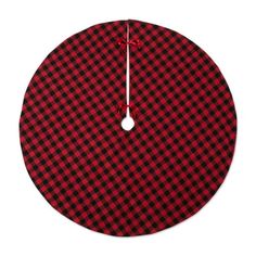 a red and black checkered clock on a white background