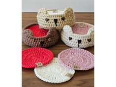 four crocheted baskets with teddy bears on them