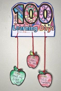 three apples hanging from the side of a sign that reads 100 learning days and teach my students