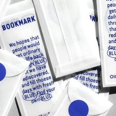 several white and blue bookmarks are stacked on top of each other with the words, we hope that people would get ordinary life back