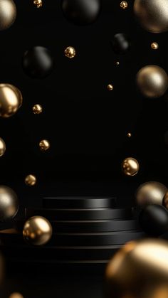 some gold and black balls are flying in the air on a black background with white steps