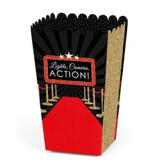 a black and red box with gold trimmings on the front, along with a red carpet that says lights camera action