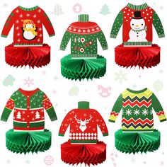 four christmas sweaters with snowman, penguin, and reindeer on them in different colors