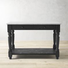 a black table with two drawers on one side and a shelf underneath it, against a white wall