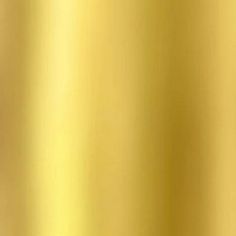 a close up view of a gold colored background