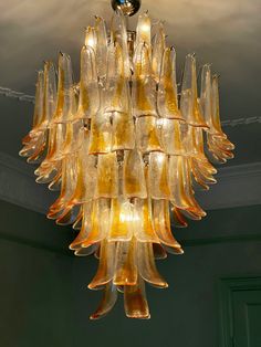 a chandelier hanging from the ceiling in a room