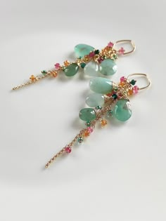 These natural aqua chalcedony are very unique, i matched them with colorful gemstones. They are full of vitality like spring. ●Aqua chalcedony ●grandidierite ●pink tourmaline ●fanta garnet ●seed beads ●total length: 81mm ● weight：6.5g Welcome to visit my Jewelry store: https://www.etsy.com/shop/Ukuly 🌸The delivery time to Most regions of North America, Australia and Europe is usually about 10-15 days. Buyers from Brazil, South Korea, and Indonesia, please provide me with your tax number through Bohemian Green Earrings With Gemstone Accents, Green Natural Stones Fusion Earrings, Fusion Green Earrings With Natural Stones, Green Natural Stone Fusion Earrings, Green Fusion Earrings With Natural Stones, Handmade Elegant Chrysoprase Earrings, Elegant Handmade Chrysoprase Earrings, Handmade Green Briolette Earrings, Handmade Green Briolette Gemstones