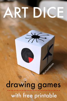 a paper box with a spider drawn on it and the text art dice drawing games with free printables