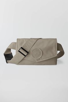 Born from the popularity of our Waist Pack, the Mini Waist Pack reimagines on-the-go essentials in smaller dimensions. The just-right size features a zippered pocket with an interior card holder. Made from  CORDURA®, the versatile accessory is ultra-durable with an adjustable strap and buckle closure that can be worn cross body or as a belt bag. Short Parka, Women Accessories Bags, Waist Pack, Boots And Sneakers, Canada Goose, Belt Bag, Boots Men, Cross Body, Kids Shoes