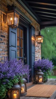 the front porch is decorated with purple flowers and lanterns