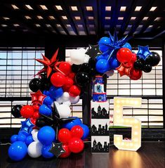 balloons are arranged in the shape of stars and fireworks