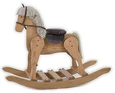 a wooden rocking horse with a saddle on it's back and legs, standing upright against a white background