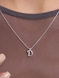 Introducing our Sterling Silver Letter Necklace, a delicate expression of personal style. This Tiny Initial Necklace features the letter "D," elegantly crafted to adorn your neckline with subtle charm. Plated in lustrous gold, this Dainty Initial Necklace adds a touch of sophistication to any outfit. Embrace individuality with this Small Monogram Necklace, a timeless accessory that speaks volumes in its simplicity. 🌸  Each piece is meticulously crafted, offering a unique and intimate touch. Ide Silver Dainty Letter Initial Necklace, Dainty Silver Initial Letter Necklace, Silver Dainty Initial Necklace, D Necklace Initial, Letter D Necklace, Silver Letter Necklace, D Necklace, Bracelet Stands, Letter Necklace Silver