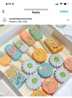 a box filled with lots of different types of cupcakes