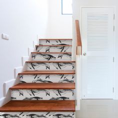 the stairs are decorated with black and white birds