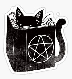 a black cat sitting in a book with a pentagramil on it's back