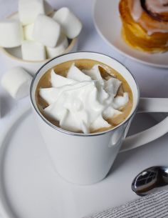 a cup of hot chocolate with marshmallows in it