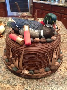 there is a cake that looks like a mallard on top of rocks