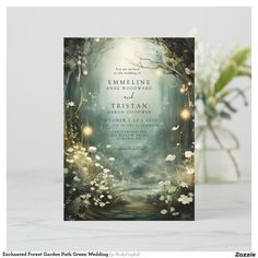 an image of a wedding card with flowers and lights in the forest, on top of a table