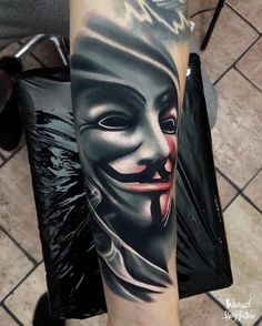 a person with a mask on their arm