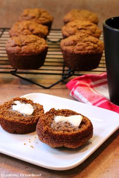 two muffins on a plate with cream cheese