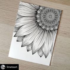 a black and white drawing of a sunflower on a piece of paper with the words line art written below it