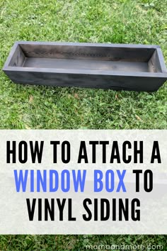 a window box sitting in the grass with text overlay how to attach a window box to vinyl siding