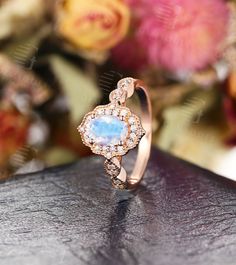 Moonstone Engagement Ring Rose Gold engagement ring Vintage Unique Wedding Oval Cut Bridal Set Milgrain Anniversary Jewelry Gift for Women Years of love story: https://www.etsy.com/shop/GemsOdes ▶ Watch Our Video about this ring: https://www.youtube.com/watch?v=icmu9HsyAhA 「Product Summary」 -center stone:5*7mm Moonstone -side stone: 0.18ct Diamond(G-H; VS-SI) -total weight:3.16g -shank thickness:1.1mm -shank width:1.8mm ◆Made of 14k /18k - Rose / White / Yellow Gold ◆All sizes are available, con White Oval Moonstone Wedding Ring, White Oval Moonstone Ring For Wedding, Oval Moonstone Wedding Ring In Fine Jewelry Style, Oval Moonstone Wedding Ring Fine Jewelry, White Oval Cabochon Moonstone Wedding Ring, Oval Moonstone Crystal Wedding Ring, Oval Halo Wedding Jewelry, Oval Halo Jewelry For Wedding, Oval Moonstone Crystal Ring For Wedding