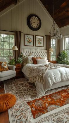 a bedroom with a large bed and lots of windows