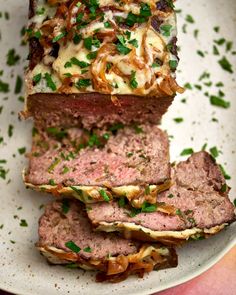 the meatloaf sandwich is cut into slices and stacked on top of each other