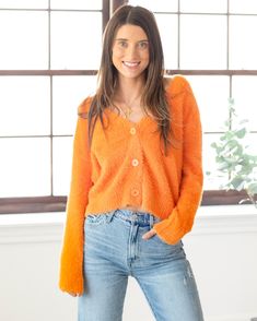 Stay cozy and stylish with our brand new Samantha Tangerine Cardi! This button-up cardigan features a fuzzy texture and a beautiful bright orange hue. Perfect for adding a pop of color and warmth to any outfit! Allie is 5'7" wearing a size small. Orange Cardigan Outfit, Mac Collection, Fuzzy Texture, Orange Cardigan, Tangerine Color, Honey Yellow, Jumpsuit Outfit, Favorite Daughter, V Neck Cardigan