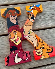 the letter k is made up of different cartoon characters and letters that are painted to look like animals