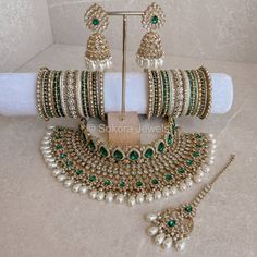 The complete Bridal jewellery set -  Antique Gold necklace set made up of clear zircon crystals and pearl drop beads. Comes complete with :Necklace, tikka,  (2 inch pendant with 4 inch chain), earrings (2.5 inch in length) and matching Bangles. This set is ready to ship as seen with gift box. Green Bridal Jewellery Set, Green Gold Jewelry, Antique Gold Necklace, Green Jewellery, Bridal Jewellery Set, Pearl Bridal Jewelry, Antique Bridal Jewelry, Gold Jewelry Sets, Green Pearls