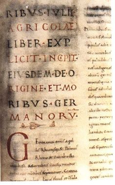 an old book with some writing on the pages and in different languages, including latin