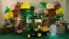 a tractor themed birthday party with balloons and decorations