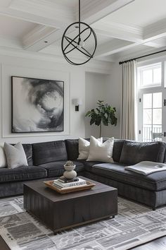 a living room filled with furniture and a painting on the wall