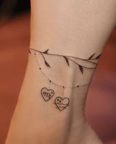 a woman's foot with two hearts on it