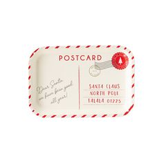 a red and white postcard tray with a santa claus stamp on the front side