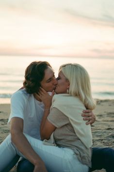 Beach film engagement photos at Lake Michigan, Michigan wedding photographer, film wedding photographer, film engagement photos, couple photos on the beach, sunset beach photoshoot, engagement photo outfits, Dom Perignon champagne, 35mm film photography, film photographer Lake Michigan Beach, Lake Michigan Beaches