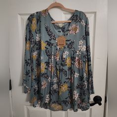 Never Worn, Brand New Shirt. Light Blue Flowy Casual Blouse, Fall Light Blue Floral Print Top, Yellow Flowy Casual Blouse, Casual Flowy Yellow Blouse, Casual Flowy Light Blue Blouse, Fall Floral Print Light Blue Top, Flowy Yellow Casual Blouse, Blue Floral Print Peasant Blouse, Long-sleeved Cotton Blouse With Embroidered Hem