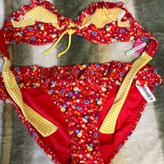 Kind Of A Country Style Bikini . Red Yellow, And Blue With Ruffles Never Worn Size Large. Retro Red Swimwear For Spring, Fun Red Swimwear For The Beach, Vibrant Red Swimwear For Poolside, Fun Red Swimwear For Pool, Red Fun Swimwear For Pool, Vibrant Red Swimwear For The Beach, Vibrant Red Swimwear For Beach, Vibrant Red Swimwear For Beach Season, Vibrant Red Swimwear For Beach Party