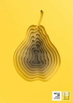 a paper cut out of a pear on a yellow background with the image of a person inside it