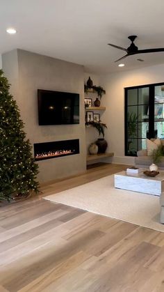 the living room is clean and ready to be used for christmas decorations, including a fireplace